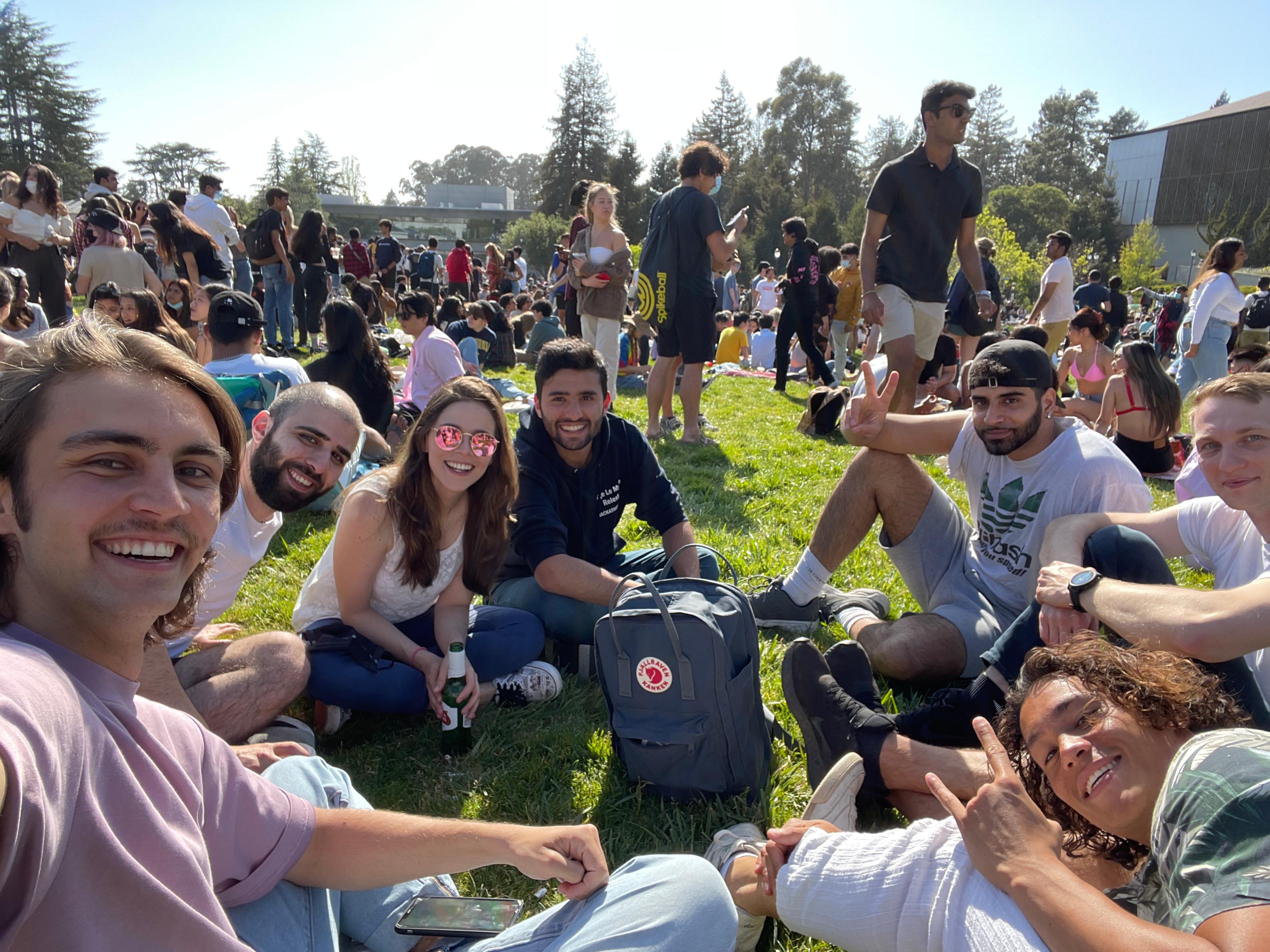 Group of students hanging out together on the lawn during at UC Berkeley an event